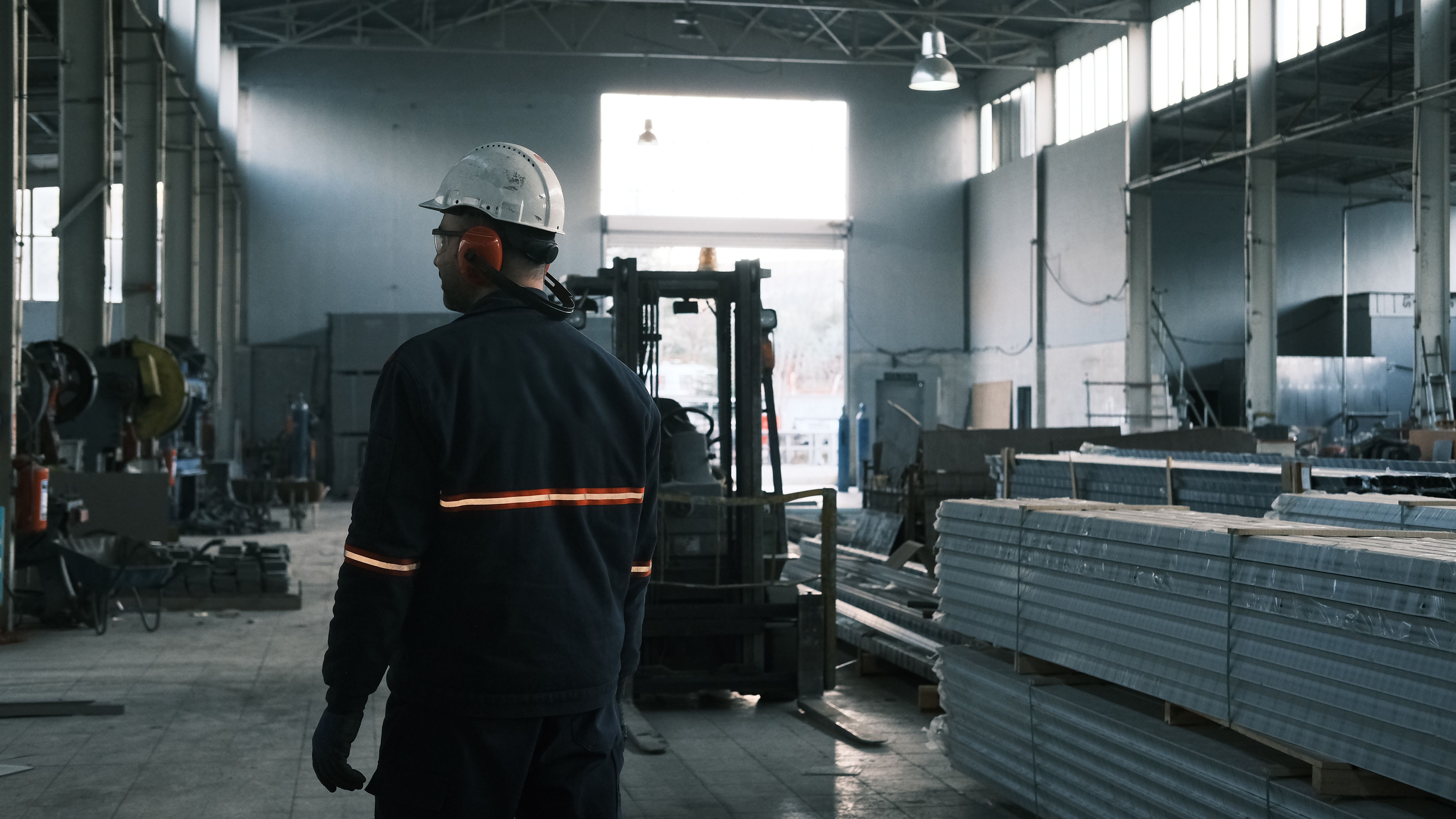 Shop-floor worker completing a safety module on a phone