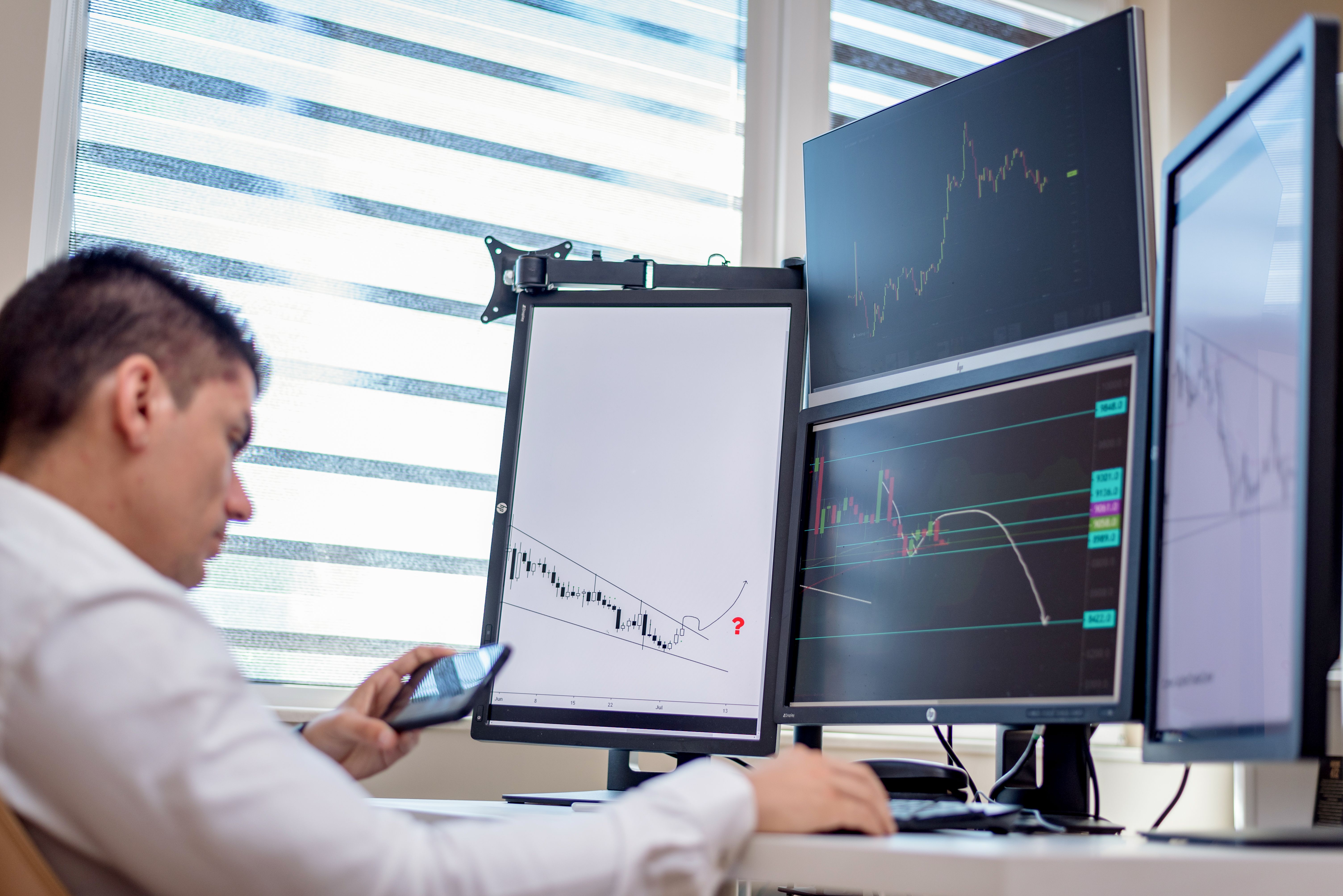 Finance professional reviewing compliance training on screen