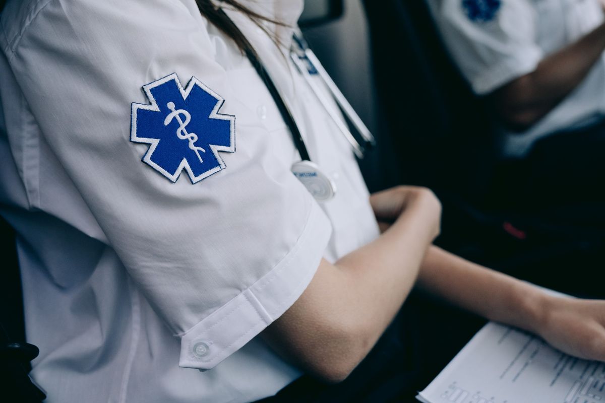 Healthcare professionals reviewing training on a tablet